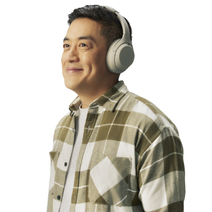 smiling man wearing headphones